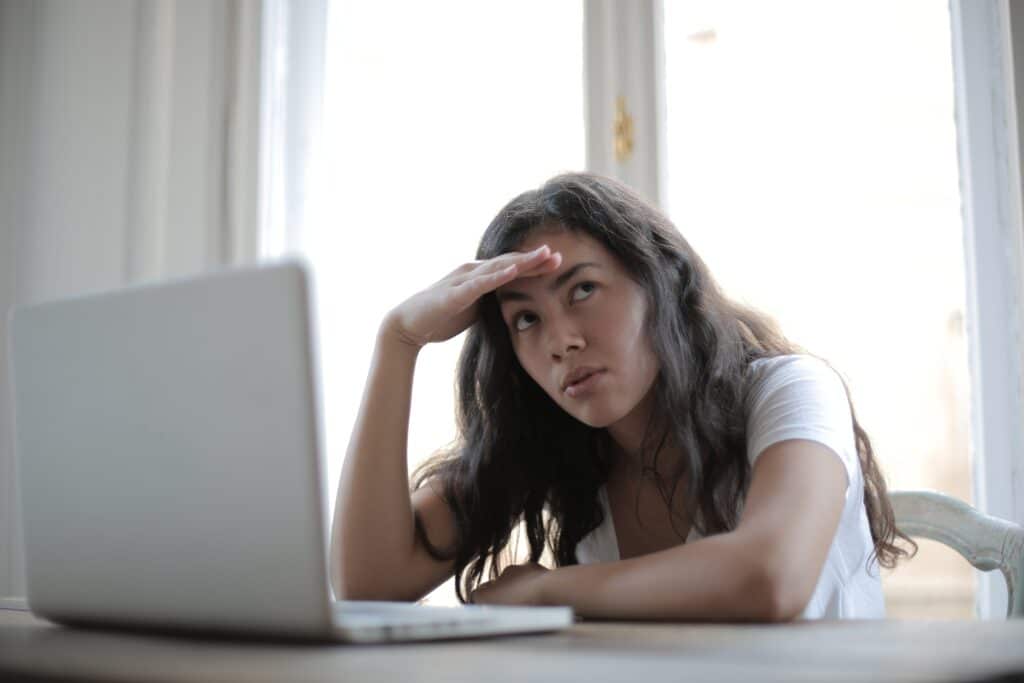 young annoyed freelancer using her laptop