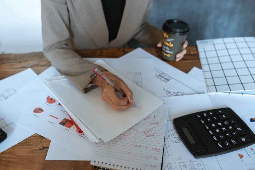 startup entrepreneur writing at their desk